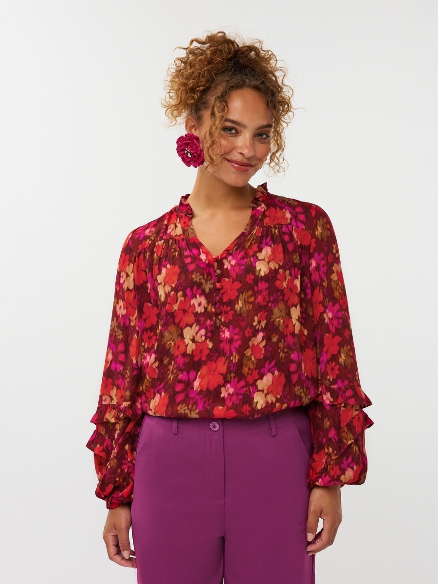 dames blouse van Fluresk met een short van fluresk in het geel, oranje en paars