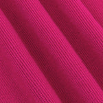 Close-up van de ribgebreide fuchsia stof van de Ydence Lenny topzacht, stretchy en comfortabel.