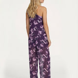Paarse jumpsuit met bloemenprint, one-shoulder design en wijde pijpen | Jo&Co Club