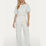 Tweedelige set wit met strikjesprint – comfortabele co-ord met wijde broek | Jo&Co Club