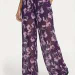 Wijde broek paars met bloemenprint – luchtig, semi-transparant model | Jo&Co Club
