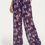 Wijde broek paars met bloemenprint – luchtig, semi-transparant model | Jo&Co Club