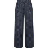 Donkerblauwe wijde broek met bruine stippenprint, vooraanzicht | Fluresk Lydia pants | Jo&Co Club