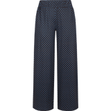 Donkerblauwe wijde broek met bruine stippenprint, vooraanzicht | Fluresk Lydia pants | Jo&Co Club