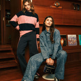 sfeerfoto van de fluresk ewan pants, de selera sweater, de rain pants en het lucy jacket.