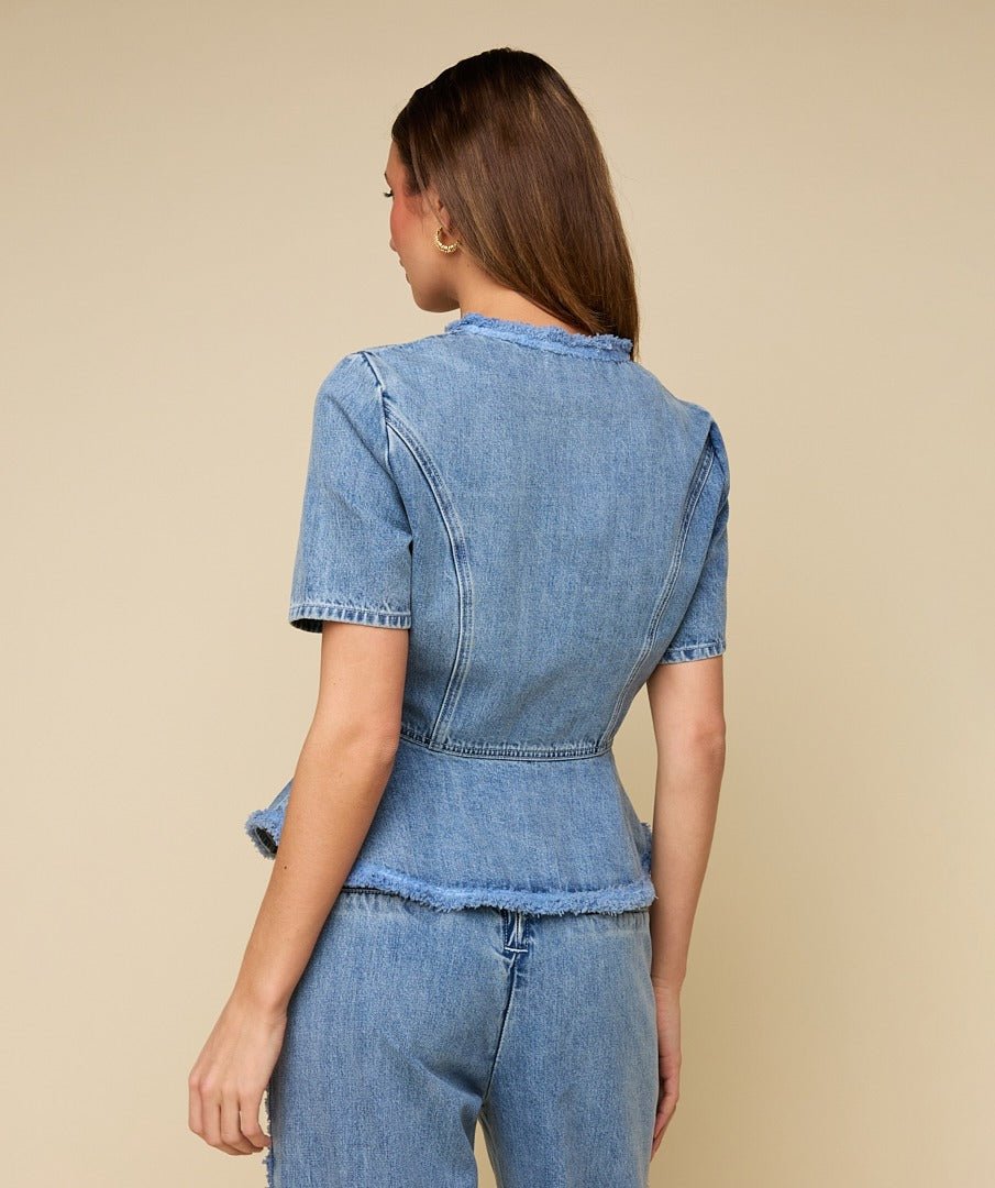 Achterkant of detail lichtblauwe denim peplum top HEYB Club Paris | Jo&Co Club