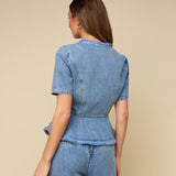 Achterkant of detail lichtblauwe denim peplum top HEYB Club Paris | Jo&Co Club