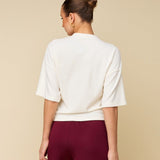 Achterkant of detail crème boxy t-shirt met logo HEYB Club | Jo&Co Club