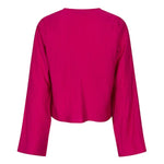 Een model presenteert een levendig fuchsia playsuit tegen een effen beige achtergrond | Lofty Manner Maeve | Jo&Co Club