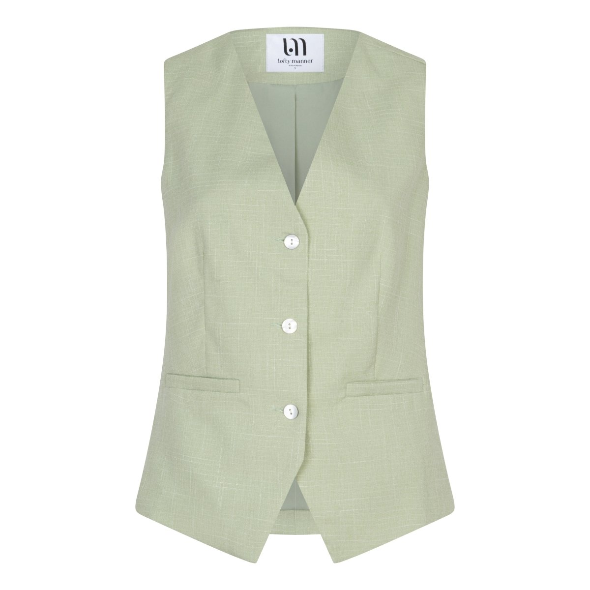 Een productfoto van een mouwloos gilet in een lichte, pistachegroene kleur, gepresenteerd | Lofty Manner Shirin | Jo&Co Club