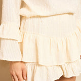 Lofty Manner Top Pia crème – Crèmekleurige top met ruffelmouwen en lovertjes | Jo&Co Club