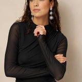 Zwarte mesh top Lofty Manner Jolien – model met opstaande hals en transparante mouwen | Jo&Co Club