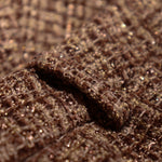 Close-up van tweed short met bruine kleur en glitter.