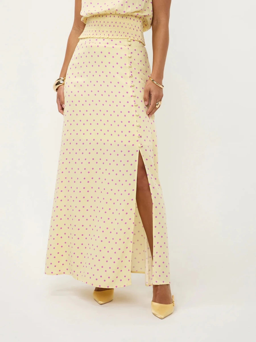 Lange, lichtgele rok met een paarse polkadotprint | Ydence Louis | Jo&Co Club