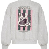 Grijze sweater met hartje en print op de rug Ydence Checked In – achterkant | Jo&Co Club