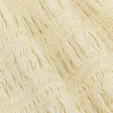Een close-up detailfoto van een zachtgele stof | Ydence Diana | Jo&Co Club