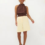 Bruine haltertop met witte polkadots, een gesmockte taille en een hoge halslijn | Ydence Jamie | Jo&Co Club